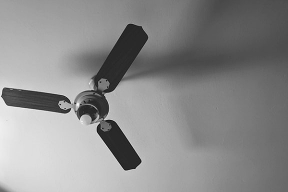 a ceiling fan hanging from a ceiling