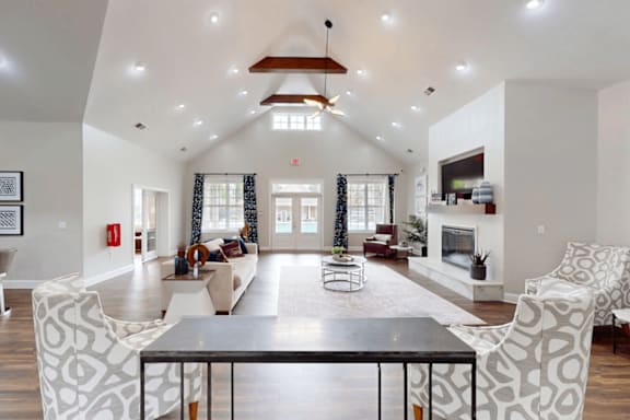 A modern living room with a fireplace and a dining table.
