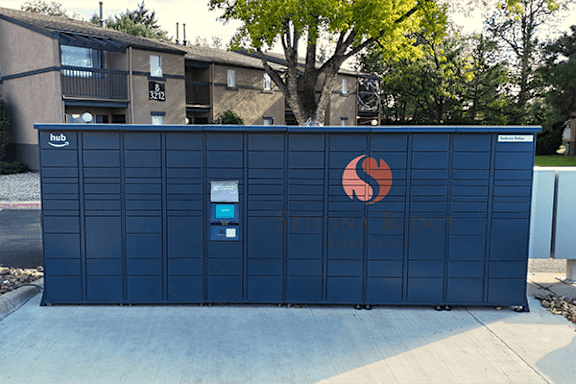 A blue storage unit with a red and white logo on the side.