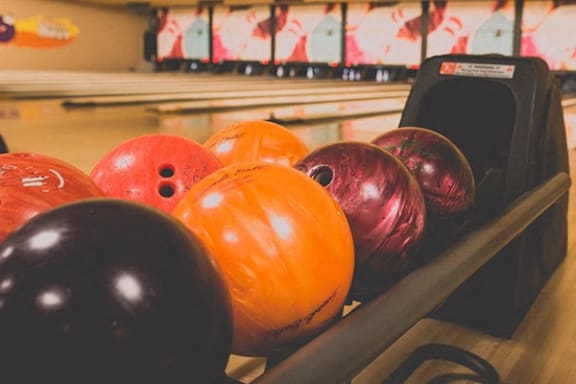 a bowling alley with bowling balls in it