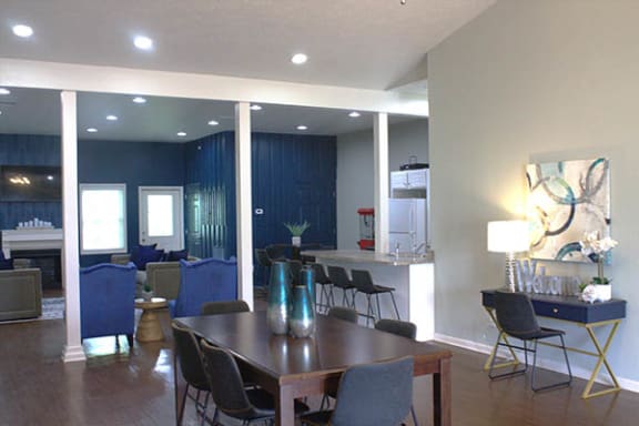 a living room filled with furniture and a wooden table