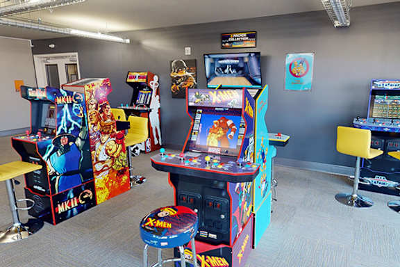 A room full of arcade games including X-men.