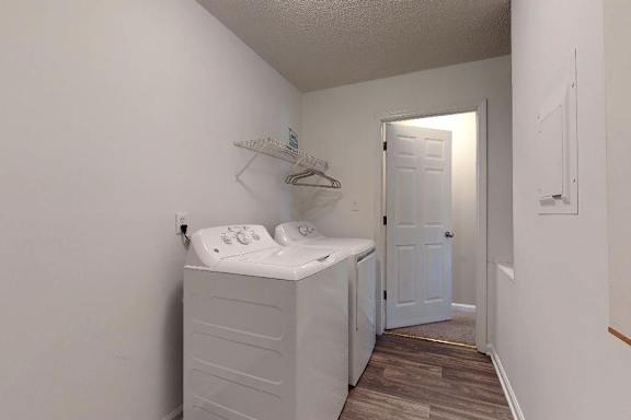 A white baby changing station in a small room.