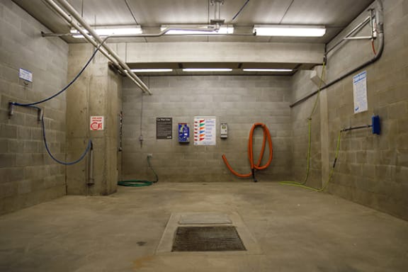 a large room with two hoses and two pumps