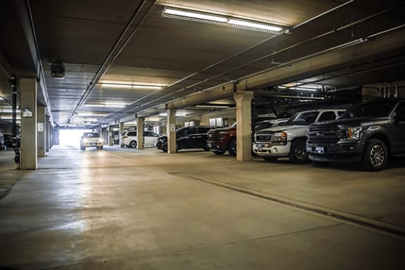 a parking garage with cars parked in it