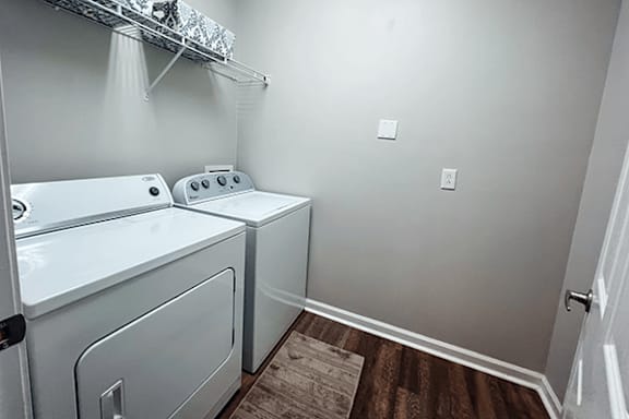 A laundry room with a washer and dryer.