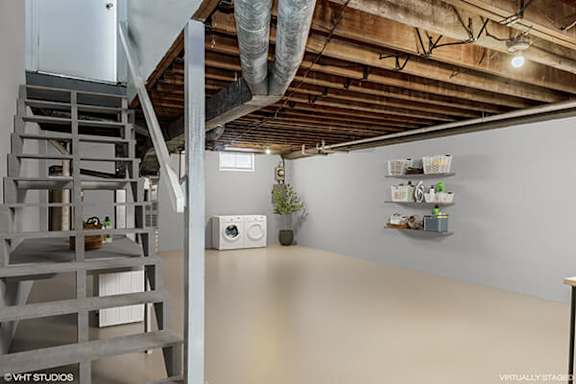 a living room with a loft and a staircase