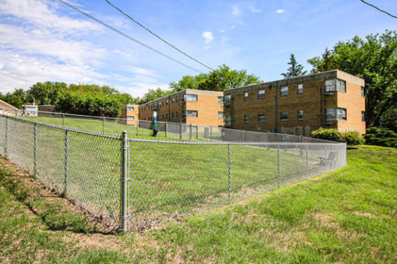 a chain link fence in front of a building