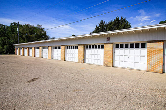a row of garage doors on the side of a building