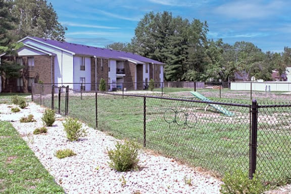 a chain link fence in front of a house
