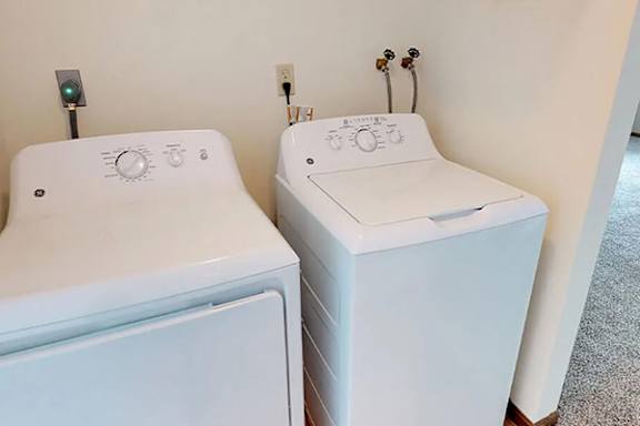 A white washer and dryer.