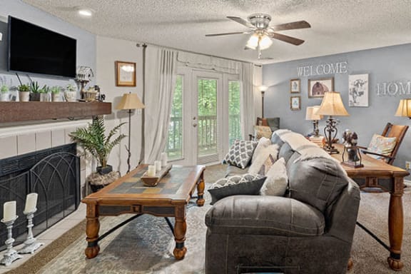 a living room with a couch and a fireplace