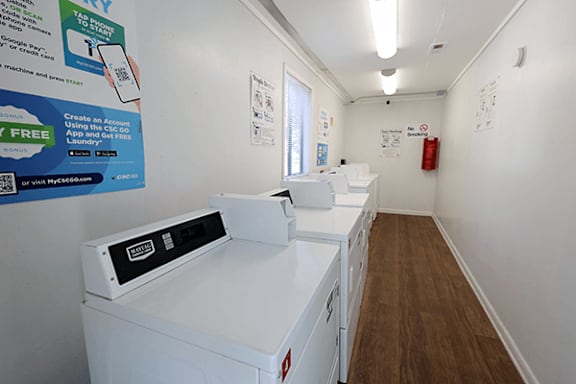 A laundry room with a washing machine and a dryer.