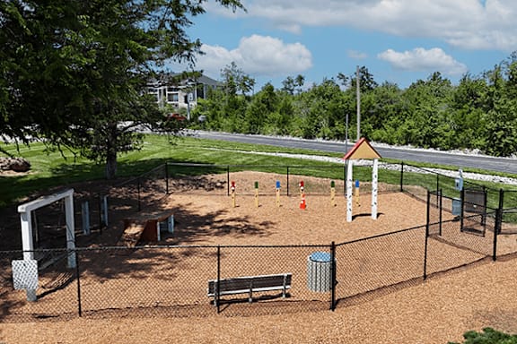 A playground with a swing set and a slide.