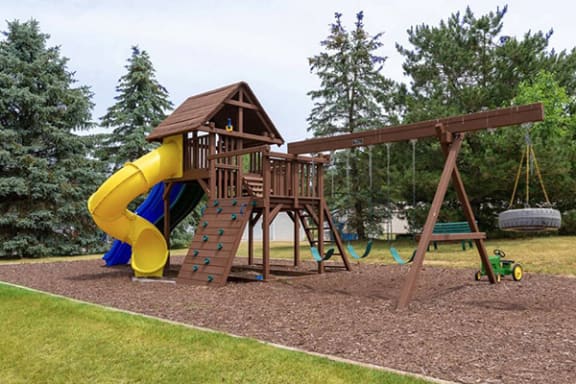 Large on-site playground at waterford pines apartments with slide and swings