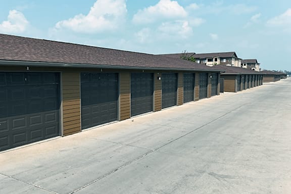 A long row of garage doors are closed.