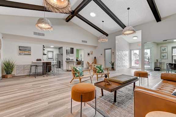 A modern living room with a wooden floor and furniture.