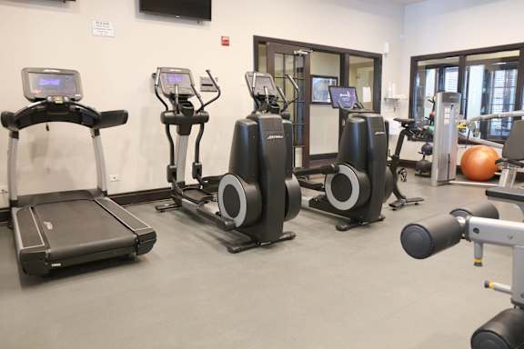 Treadmill and weights for fitness at Regency Place, Oakbrook Terrace, Illinois
