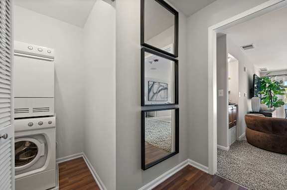 A modern kitchen with a white oven and a white fridge.