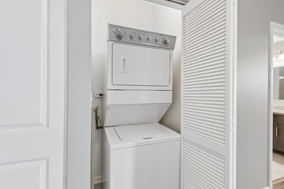 A white oven and dishwasher in a kitchen.