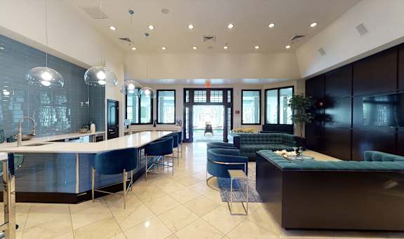 Clubhouse with couch and table at Regency Place, Oakbrook Terrace
