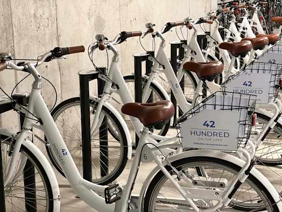 A row of bicycles are parked and labeled 42 Hundred.