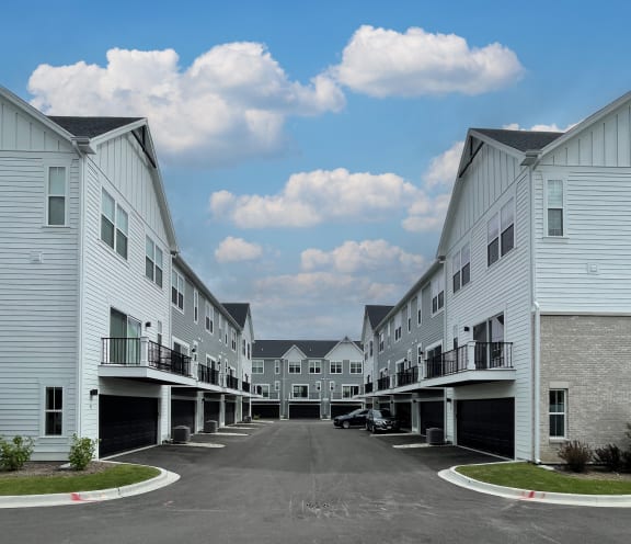 a row of white houses with balconies at Enclave Crystal Lake Townhomes and Apartments, Illinois