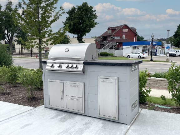 a barbecue grill on a patio at Enclave Crystal Lake Townhomes and Apartments, Crystal Lake, Illinois
