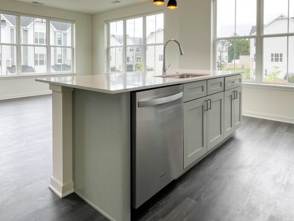 a large kitchen with a large island and a sink in it at Enclave Crystal Lake Townhomes and Apartments, Illinois