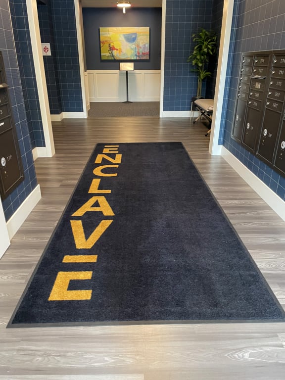 a navy rug on the floor of a locker room at Enclave Crystal Lake Townhomes and Apartments, Crystal Lake, Illinois