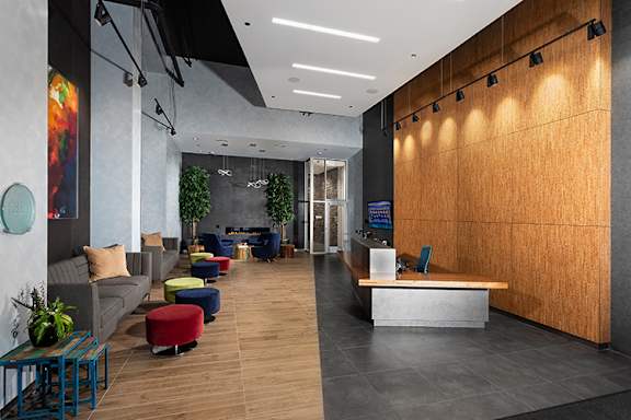 a rendering of a lobby with couches and chairs at Residences at Addison Clark Apartments, Chicago