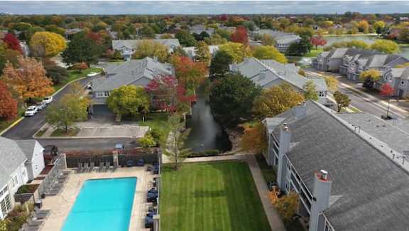 A residential area with houses and a swimming pool.