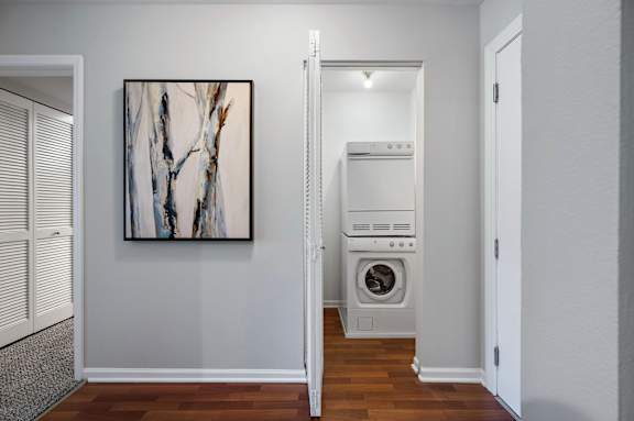 A modern laundry room with a washer and dryer.