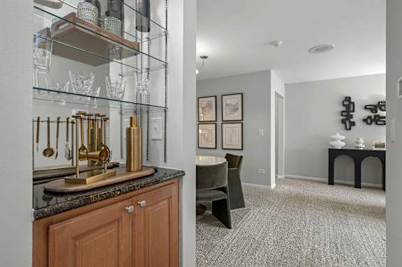 A kitchen with a counter and a chair.