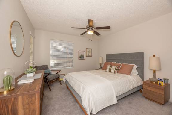 Fusion 35 bedroom with a bed, nightstand, and a ceiling fan.