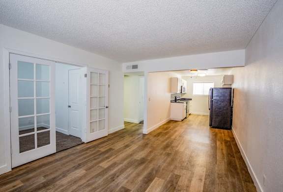 Living Room with wooden floors and white walls.