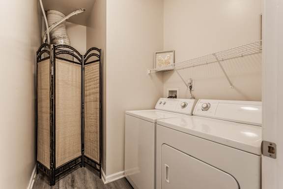 A laundry room with a washer and dryer.