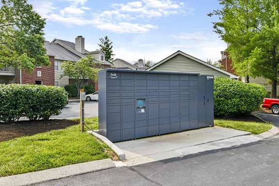 A grey garage door is closed and has a small window on the right side.