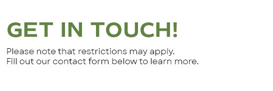 A sign that says "GET IN TOUCH!" and notes that restrictions may apply.