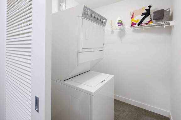A white oven and dishwasher in a kitchen.