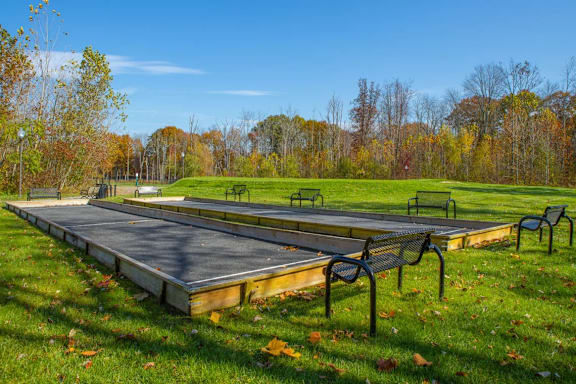 A park with a stage and seating area.