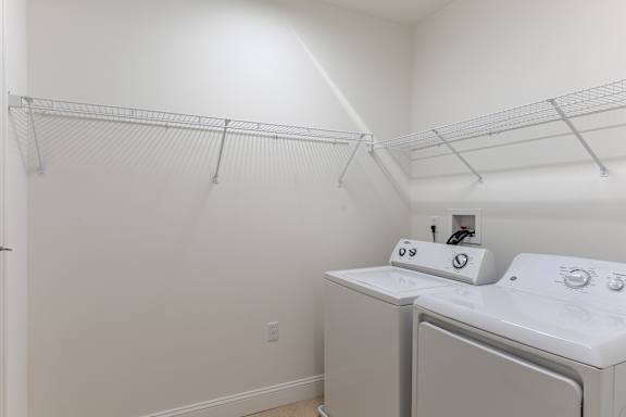 A laundry room with a washer and dryer.