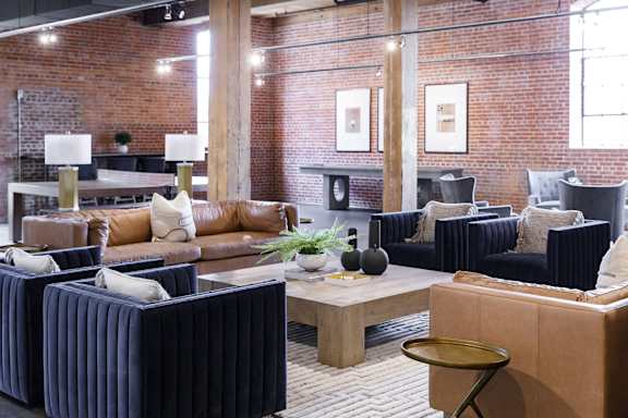 a lobby of a hotel with couches and tables at The Mill at Prattville, Prattville, AL