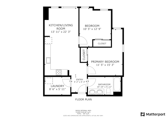A floor plan of a home with a laundry room, kitchen/living room, and two bedrooms.