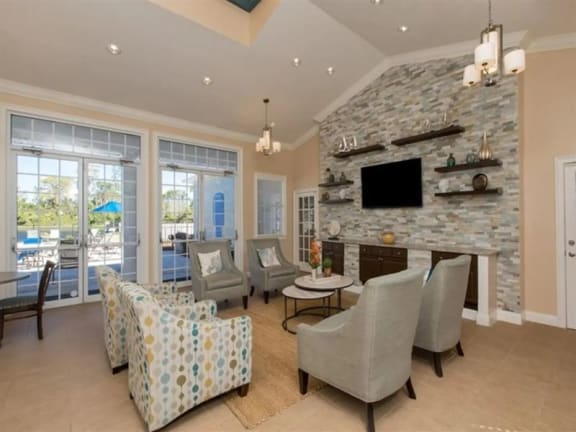 a living room filled with furniture and a flat screen tv