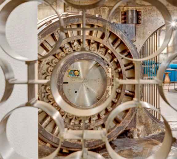 A large, circular, metallic object with a central hub and multiple spokes.