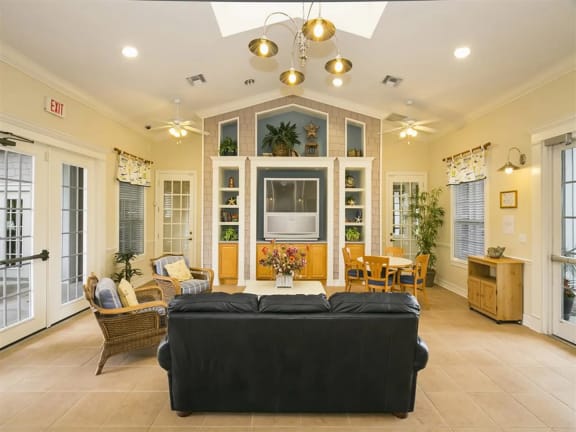 a living room filled with furniture and a large window