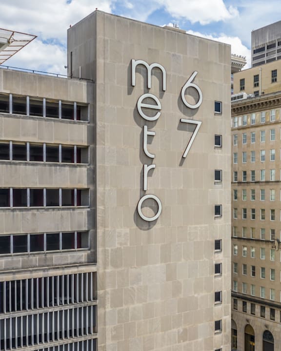 A tall building with the word "metro" on it.
