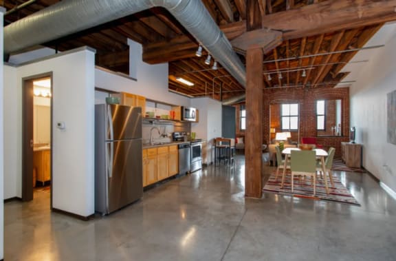 a large kitchen and dining area in a loft