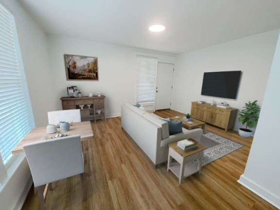 a living room with white furniture and a tv